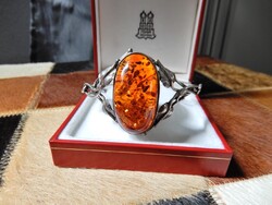 Old silver bracelet with large amber