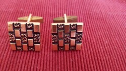 Mandzsetta gomb fekete-arany színű