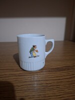 Zsolnay mesés, mese mintás porcelán szoknyás bögre. 9,2 cm. Hibátlan. Jelzett.
