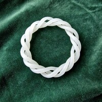 Asian white jade bangle carved from a single piece, formed as two interlaced, articulated helices