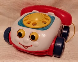 Játék telefon...tárcsázáskor 'csenget egy picit'.