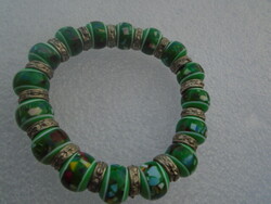 Pandora style bracelet with charm and Tibetan accessories, rubber so it fits almost any wrist