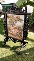 Old, hand-carved fireplace screen with tapestry insert