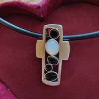 Silver-colored pierre lang pendant on a rubber chain with opalite and onyx stones