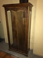 Small, narrow Art Nouveau carved vitrine with glass shelves