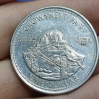 Kanadai helyi kereskedelmi és jubileumi „Crowsnest Pass - One Dollar” (1985) emlékérem (Trade Dollar