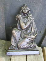 Old cast iron decorative sculpture of Mary