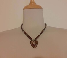 Beautiful bone necklace with heart-shaped pendant