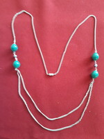 Eye-catching costume jewelry chain with green beads
