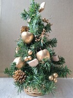 Decorated retro table artificial Christmas tree with golden apples, pine cones, birch bark decorations in a basket pot