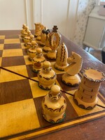 Folding inlaid chess table with carved pieces