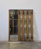 Retro, mid-century modern hallway wall with coat rack and mirror
