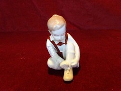 Aquincum porcelain figural statue, little boy tying shoes. 11 cm high, 10 cm wide. He has!