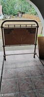 Antique iron bed, with missing inlay at head and foot ends.