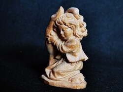 Carved Wooden Sculpture: Guardian Hand with Baby