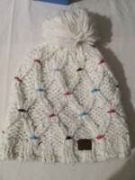 Warm, off-white Lafuma winter hat with soft polar lining and colorful dots
