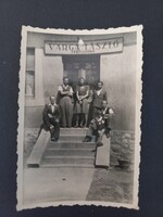 Varga László Men's Tailor Shop – family and staff group photo in front of the shop, 1940s
