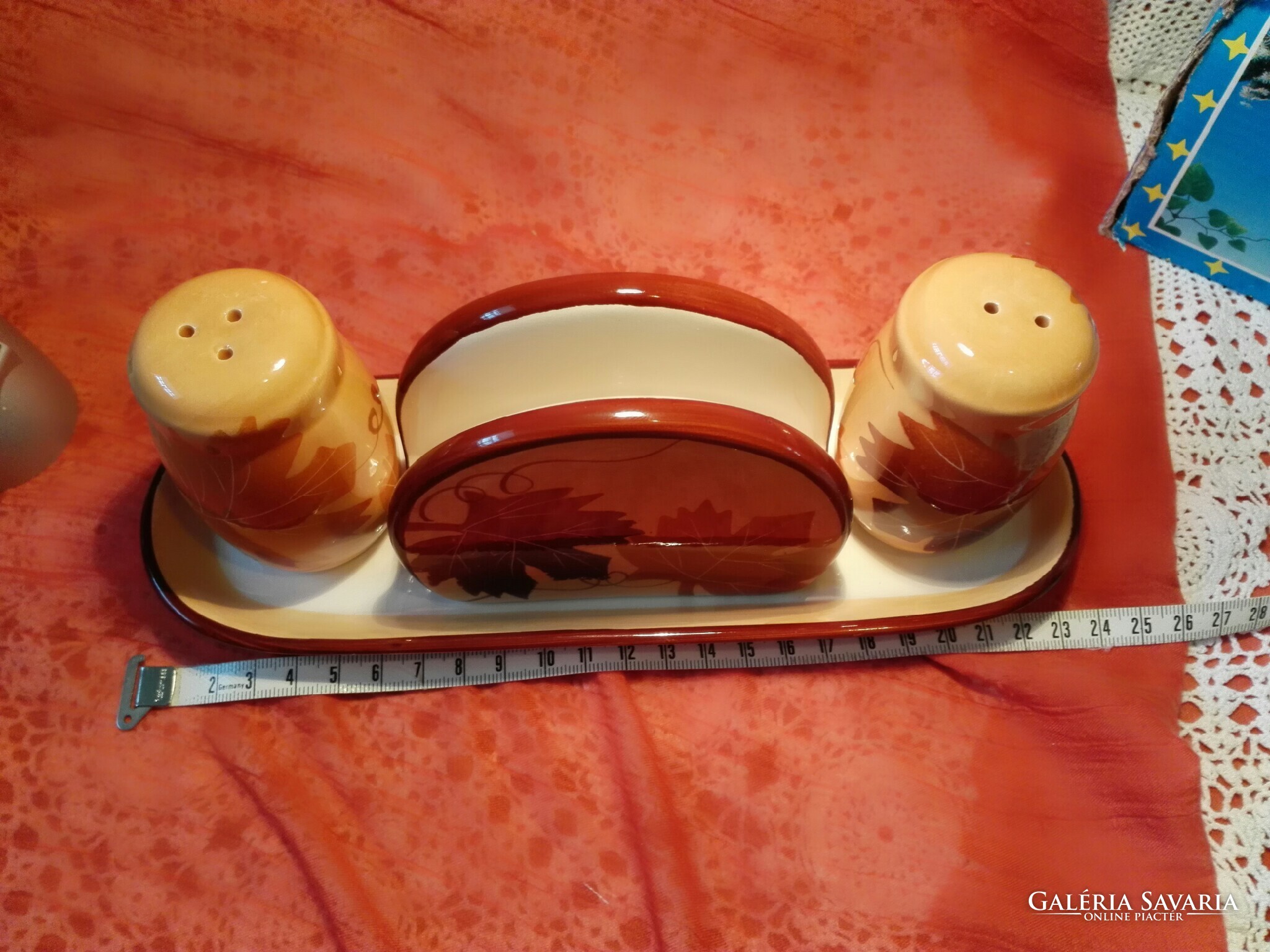 New, ceramic table salt, pepper shaker, napkin holder on a small