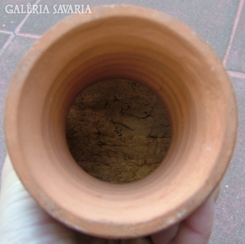 Ceramic drum with leather coating.
