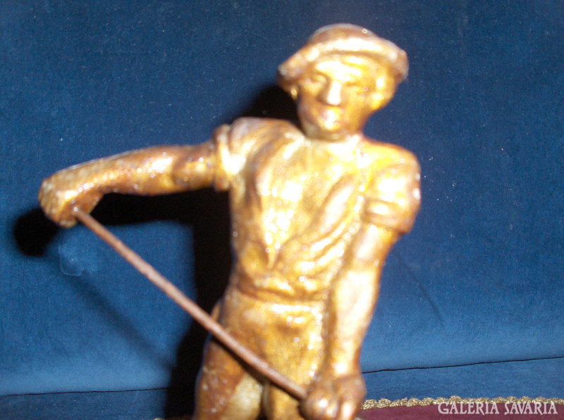 Metal worker statue on wooden base - master blacksmith