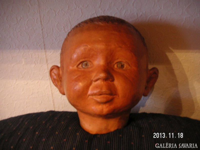 Terracotta representation of a child is a high-quality, artistic sculptural work, not marked
