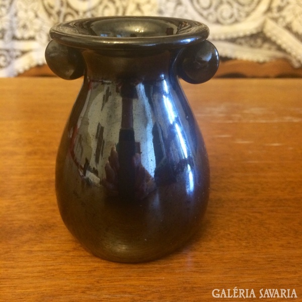 Vase with little black badger