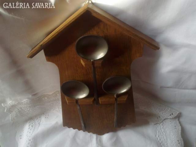 Old wooden spoon holder with spoons