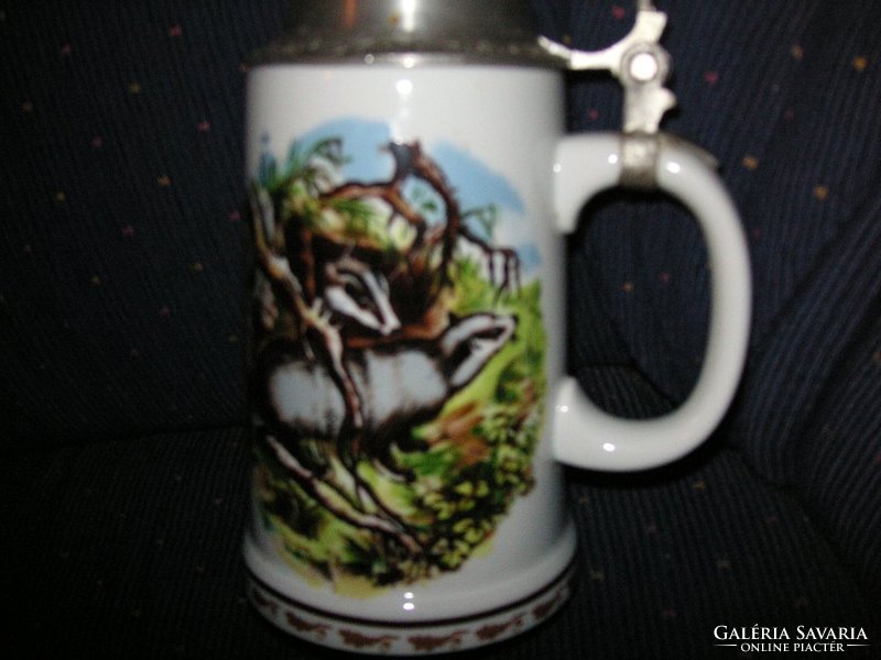 Nice porcelain beer mug from Ndk, with a hunting scene and badgers