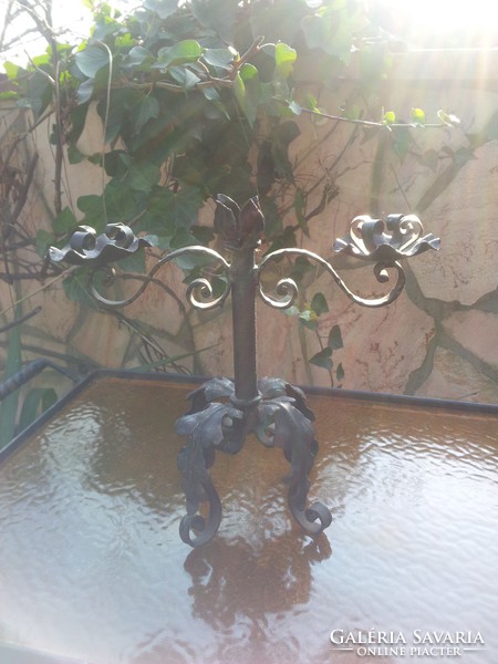 Antique wrought iron candlestick with two arms