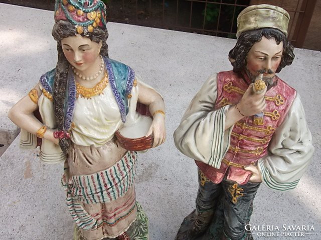 Antique large porcelain figurine in Slavic folk costume
