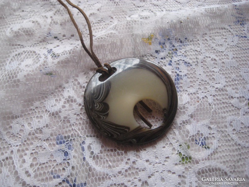 Necklace with pendant and leather strap