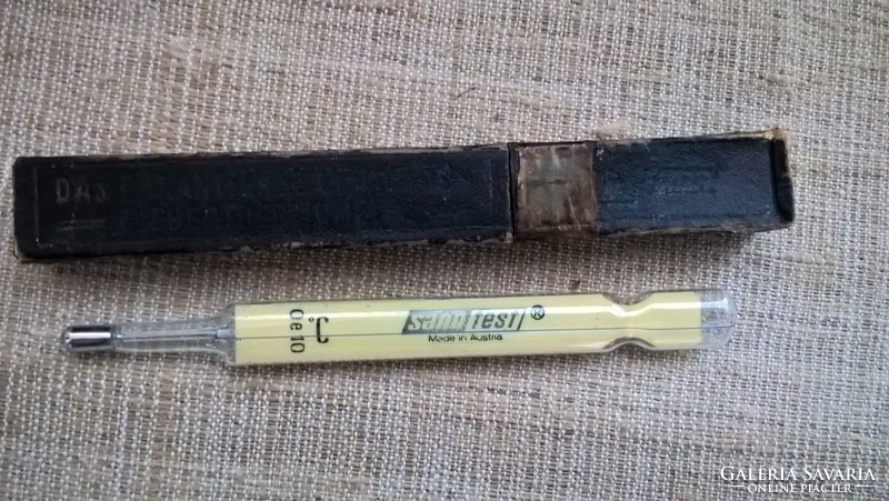 Old marked glass thermometer in its case