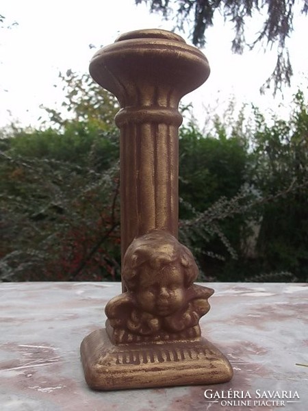 Hourglass candle holder with angel head and putti
