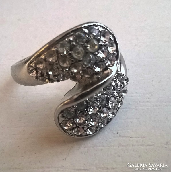 Silver-plated fashion ring in good condition, studded with small stones