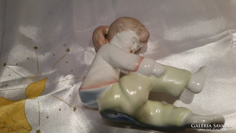 Little girl lacing shoes 2 pieces for sale! Pair of porcelain statues for sale!