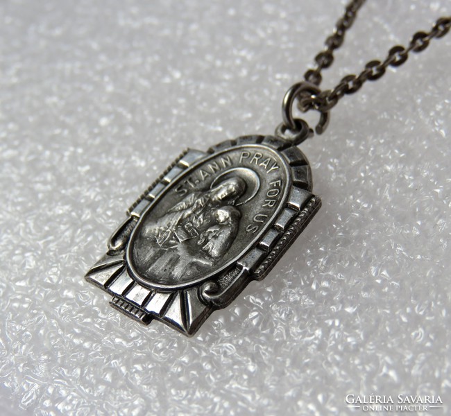 Beautiful, antique silver pendant with a religious theme