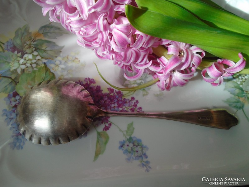 Beautiful large English antique garnished spoon.