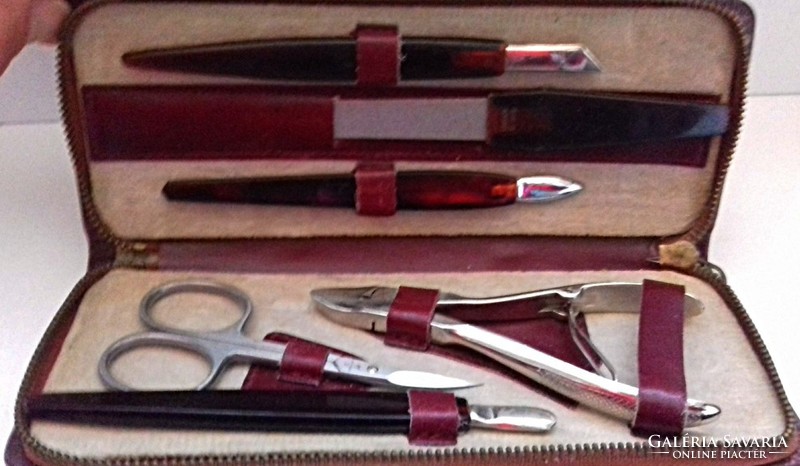 Old manicure set in a nice condition in a leather case.