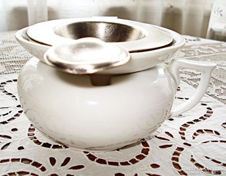 Old silver-plated alpaca tea strainer and porcelain drip tray
