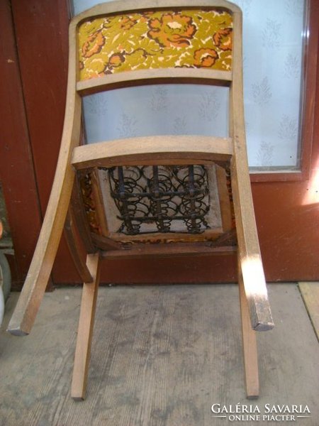 Old upholstered chair with backrest