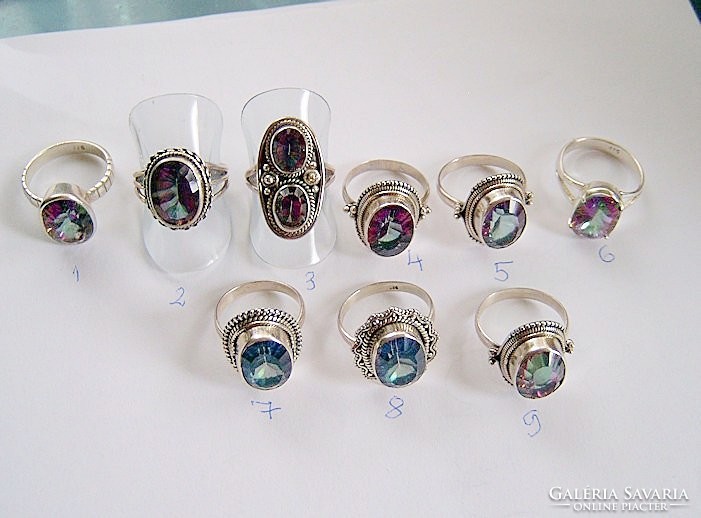 Mystical topaz rings in blue and rainbow colors