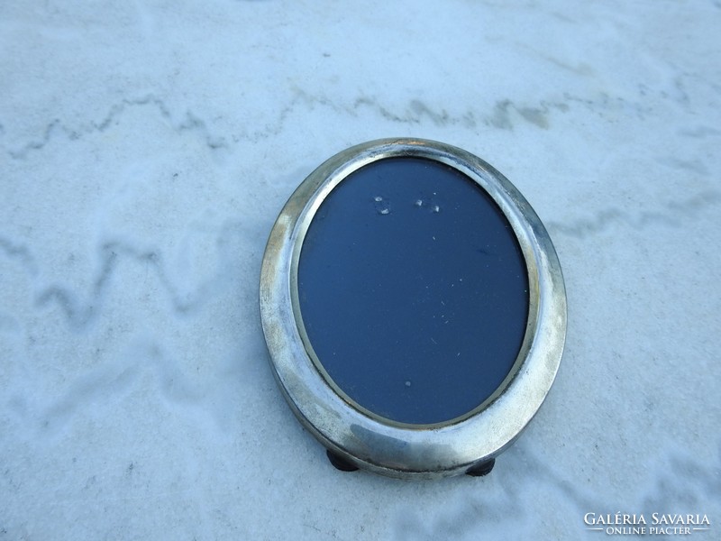 Oval silver colored vintage mirror
