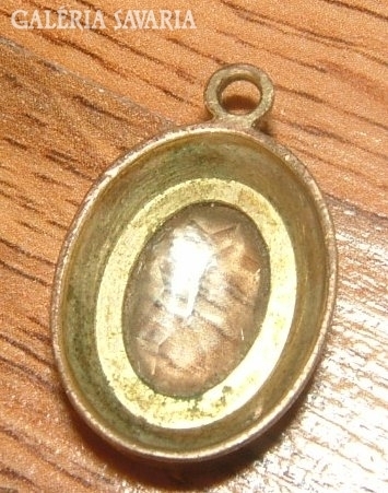 Antique copper (?) pendant with pale blue jewel