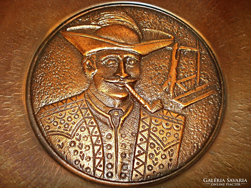 Applied art folk art, bronze wall bowl depicting an outlaw