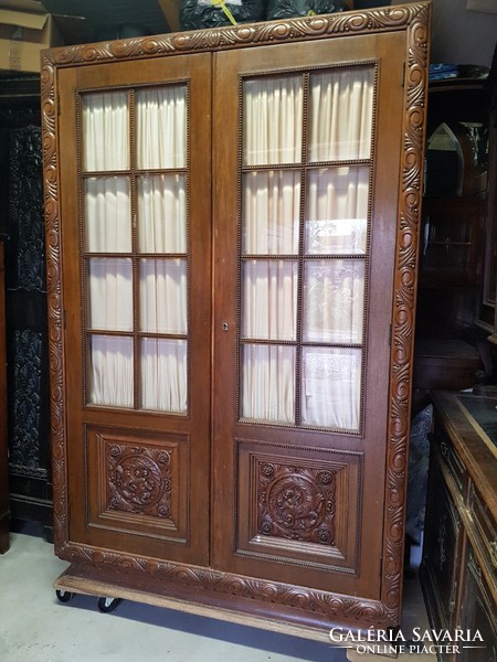 Glazed art-deco carved solid oak cabinet