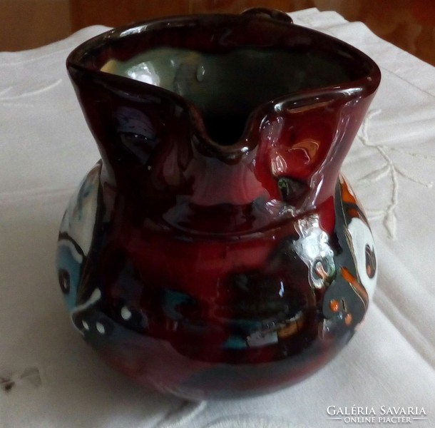 Ceramic jug with a fish pattern