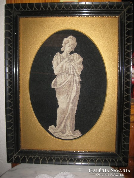 Shadow image with antique carved frame with gold passe-partout