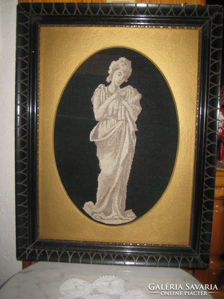 Shadow image with antique carved frame with gold passe-partout