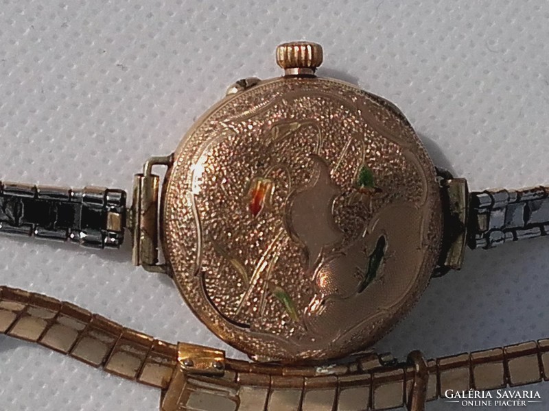 Gold watch is 14 carats, 31 grams.