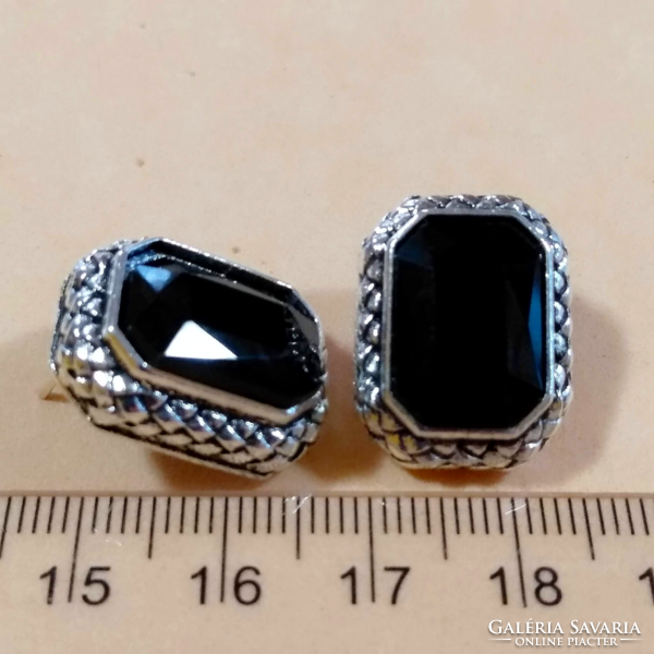 Black faceted stone earrings in a silver socket